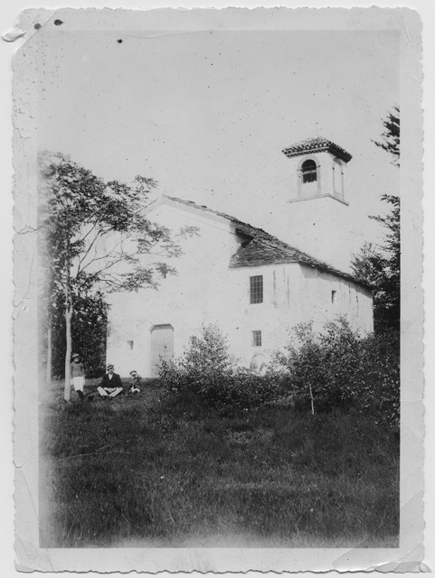 Uomo con bambini all'oratorio di San Clemente